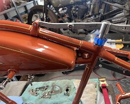 Nickel plated seat bracket and spring assembly in place.